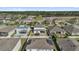 Overhead view of houses with fenced yards, solar panels, and community landscaping at 2129 Stillwood Way, St Cloud, FL 34771