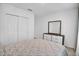 Well-lit bedroom with closet, dresser with mirror, and calming neutral tones creating a relaxing atmosphere at 2129 Stillwood Way, St Cloud, FL 34771
