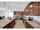 Well-equipped kitchen with granite countertops, stainless steel appliances, and ample cabinet space at 2129 Stillwood Way, St Cloud, FL 34771