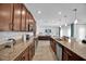 Well-equipped kitchen with granite countertops, stainless steel appliances, and ample cabinet space at 2129 Stillwood Way, St Cloud, FL 34771