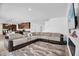 Open living space with a sectional couch and a view into the kitchen and dining area at 2129 Stillwood Way, St Cloud, FL 34771