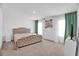 Bright bedroom featuring a tufted headboard bed, modern curtains and an elegant yet comfortable style at 2129 Stillwood Way, St Cloud, FL 34771