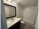 Well-lit bathroom with a sleek vanity, and tub-shower combination at 220 Brookes Pl, Haines City, FL 33844