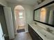 Modern bathroom featuring a double vanity, sleek countertops, and a glass shower enclosure at 220 Brookes Pl, Haines City, FL 33844