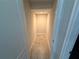 A walk-in closet featuring tile flooring and a light, offering ample storage space at 220 Brookes Pl, Haines City, FL 33844