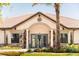 Charming community clubhouse with stone accents, lush landscaping and inviting entrance at 220 Brookes Pl, Haines City, FL 33844