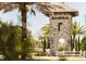 Grand stone entrance to Balmoral community framed by lush greenery and mature palm trees at 220 Brookes Pl, Haines City, FL 33844