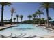 Stunning community pool surrounded by lush palm trees offers a resort-style experience at 220 Brookes Pl, Haines City, FL 33844