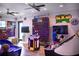 Community game room featuring vibrant décor, arcade games, and entertainment for all ages at 220 Brookes Pl, Haines City, FL 33844