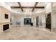 Spacious lobby area with elegant chandelier, fireplace, and tiled flooring at 220 Brookes Pl, Haines City, FL 33844