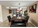 Open dining area showcasing a dining set with a faux marble table, chairs, and bench seating at 2494 Sweetwater Club Cir # 55, Kissimmee, FL 34746