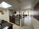 View of open living area leading to the dining area with natural light and neutral colors at 2494 Sweetwater Club Cir # 55, Kissimmee, FL 34746