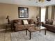 Comfortable living room with plush sofas, stylish decor, neutral colors, and great natural light at 2494 Sweetwater Club Cir # 55, Kissimmee, FL 34746