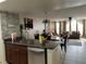 Open floorplan showcasing the kitchen and living area with natural light at 2494 Sweetwater Club Cir # 55, Kissimmee, FL 34746