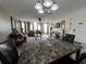 Open-concept living and dining area with neutral colors and a ceiling fan at 2494 Sweetwater Club Cir # 55, Kissimmee, FL 34746