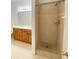Bright bathroom with double sink vanity and a tiled standing shower at 296 Sand Ridge Dr, Davenport, FL 33896
