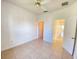 Bedroom featuring tile floors, ceiling fan, and natural light at 296 Sand Ridge Dr, Davenport, FL 33896