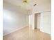 Bedroom featuring tile floors, ceiling fan, and closet with sliding doors at 296 Sand Ridge Dr, Davenport, FL 33896