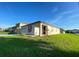 Exterior view of the house and lawn at 296 Sand Ridge Dr, Davenport, FL 33896