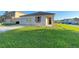 Charming single-story home with attached garage and manicured lawn at 296 Sand Ridge Dr, Davenport, FL 33896