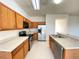 A well-equipped kitchen includes stainless appliances, ample counter space, and wood cabinetry at 296 Sand Ridge Dr, Davenport, FL 33896