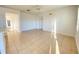 Spacious living area with tile floors, neutral paint, and views into other living spaces, great for entertaining at 296 Sand Ridge Dr, Davenport, FL 33896