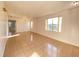 Open living room with tile floors, bright lighting, and large windows offering pleasant views of the neighborhood at 296 Sand Ridge Dr, Davenport, FL 33896