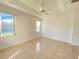 This main bedroom has a tray ceiling, ceiling fan and lots of light at 296 Sand Ridge Dr, Davenport, FL 33896