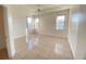 Spacious main bedroom with tile flooring, tray ceiling, ceiling fan and bright natural light at 296 Sand Ridge Dr, Davenport, FL 33896