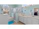 Bright bathroom with double vanity, soaking tub, glass shower, and plenty of natural light at 311 N Hampton Dr, Davenport, FL 33897