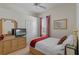 Bright bedroom featuring a closet, a ceiling fan, and natural light at 311 N Hampton Dr, Davenport, FL 33897