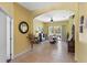 Formal dining room with tile flooring, a ceiling fan, and sliding glass doors to the backyard at 311 N Hampton Dr, Davenport, FL 33897