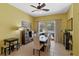 Dining area with tile flooring, a ceiling fan, and sliding glass doors to the outdoor lanai and pool at 311 N Hampton Dr, Davenport, FL 33897