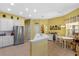 Bright kitchen with stainless steel appliances, ample counter space, and an adjacent dining area at 311 N Hampton Dr, Davenport, FL 33897
