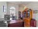 Brightly lit home office with built in shelves, laminate floors and large window at 311 N Hampton Dr, Davenport, FL 33897