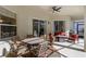 Covered patio with ceiling fan, table, grill, and multiple seating areas is perfect for entertaining at 311 N Hampton Dr, Davenport, FL 33897