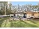 Relaxing backyard with outdoor seating area and lush lawn at 3165 Maple Run, Kissimmee, FL 34744