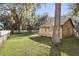 Spacious backyard with a shed, mature trees, and a well-maintained lawn at 3165 Maple Run, Kissimmee, FL 34744