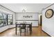 Bright dining room featuring hardwood floors and a window providing natural light at 3165 Maple Run, Kissimmee, FL 34744