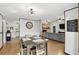Dining room connecting to the kitchen and living room, creating a seamless flow at 3165 Maple Run, Kissimmee, FL 34744