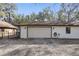 Attached garage with ample parking space and outdoor lighting at 3165 Maple Run, Kissimmee, FL 34744