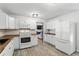Bright kitchen with white cabinets, stainless steel appliances and butcher block countertops at 3165 Maple Run, Kissimmee, FL 34744