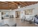 Expansive living room featuring tile floors, wood ceilings, and natural light from windows and glass doors at 3165 Maple Run, Kissimmee, FL 34744