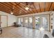 Sunroom features tiled floors, wood ceiling, and multiple windows providing natural light at 3165 Maple Run, Kissimmee, FL 34744