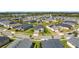 Beautiful aerial view of the property and neighborhood surrounded by tree-lined streets at 3240 Songbird Cir, Harmony, FL 34773