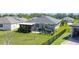 Expansive backyard with lush lawn, screened patio, and privacy fence, perfect for outdoor living and entertaining at 3240 Songbird Cir, Harmony, FL 34773