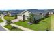 Well-maintained single-story home with an attached garage and a beautifully landscaped front yard at 3240 Songbird Cir, Harmony, FL 34773