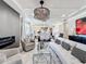 Spacious open concept with elegant finishes, including tray ceilings, a fireplace, and an adjacent dining area at 3240 Songbird Cir, Harmony, FL 34773