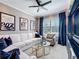 Cozy living room with custom curtains, neutral tones, and comfortable seating around a stylish coffee table at 3240 Songbird Cir, Harmony, FL 34773