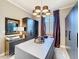 Custom walk-in closet featuring ample storage, a central island, and well-organized shelving and drawers at 3240 Songbird Cir, Harmony, FL 34773